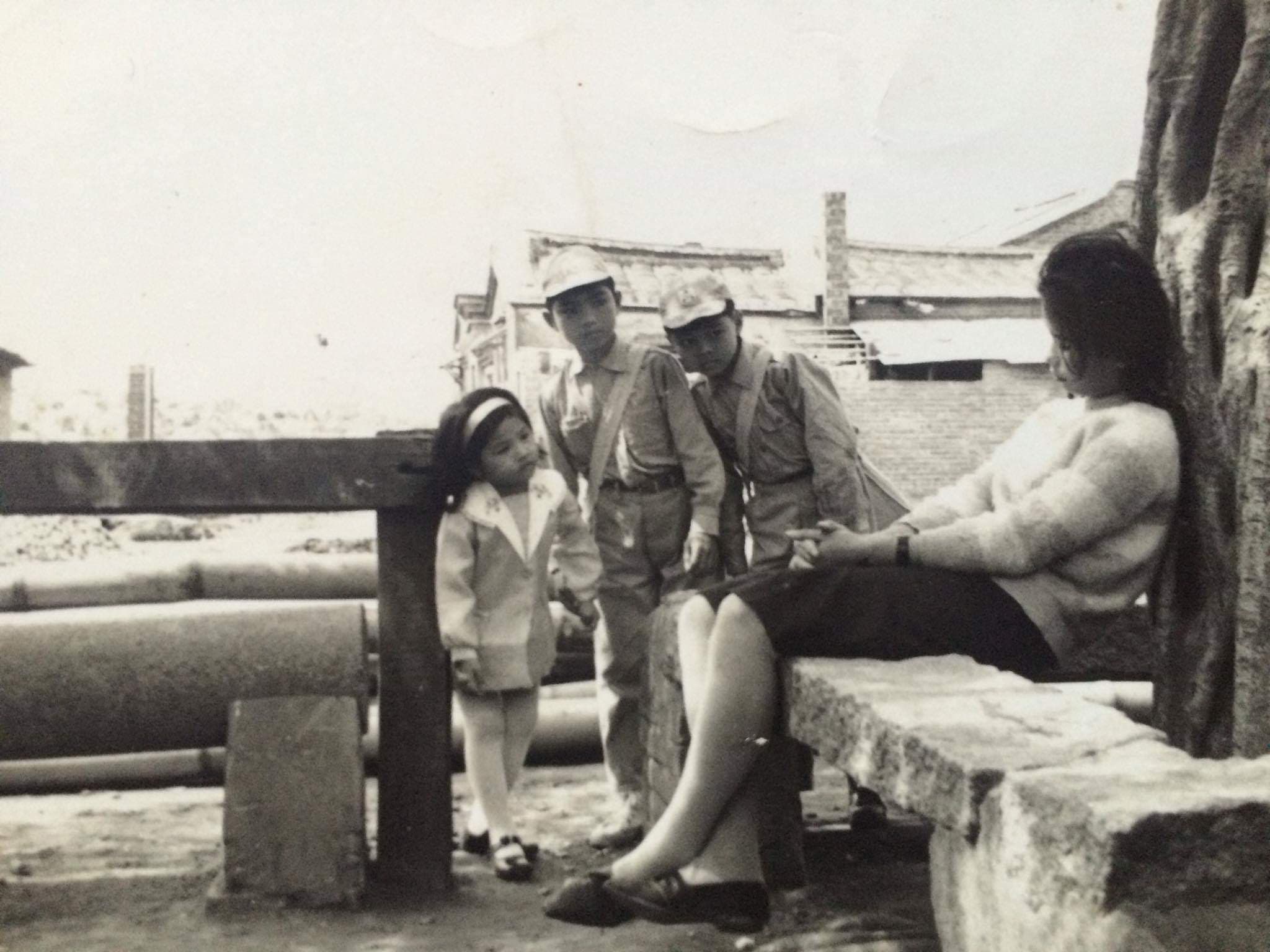 A black-and-white movie scene with Julia's mom as the child on the far left